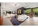 Open concept living area with modern furnishings, natural light, and seamless indoor/outdoor flow at 3891 Wieuca Rd, Atlanta, GA 30342