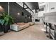 Open-concept living room features modern decor, polished concrete floors, ample natural light, and a view of the outside at 3891 Wieuca Rd, Atlanta, GA 30342