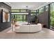 Modern living space with floor to ceiling windows, designer decor, and an open-concept design at 3891 Wieuca Rd, Atlanta, GA 30342
