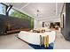 Spacious living area showcasing modern design, ample seating, and floor-to-ceiling windows at 3891 Wieuca Rd, Atlanta, GA 30342