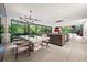 Open floorplan with large windows offering natural light into the kitchen, dining, and living spaces at 3891 Wieuca Rd, Atlanta, GA 30342