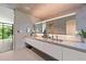 Modern bathroom featuring a large mirror, a long vanity, and modern fixtures at 3891 Wieuca Rd, Atlanta, GA 30342