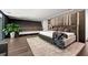 The main bedroom is spacious with modern lighting and decorative wood paneling at 3891 Wieuca Rd, Atlanta, GA 30342
