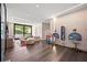 Bright playroom with hardwood floors, stylish furniture, and sleek lighting creating an inspiring place to learn at 3891 Wieuca Rd, Atlanta, GA 30342