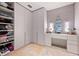 A dressing room and walk-in closet with custom shelves, drawers, vanity, and lighting at 3891 Wieuca Rd, Atlanta, GA 30342