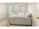 Bedroom with neutral carpet, two windows, and lots of natural light at 5745 Crystal Springs Way, Powder Springs, GA 30127