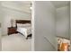 Carpeted bedroom featuring a wooden bed frame, carpet, and a bedside table at 5745 Crystal Springs Way, Powder Springs, GA 30127