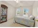 Spacious bedroom features two windows, tray ceilings, and an decorative armoire at 5745 Crystal Springs Way, Powder Springs, GA 30127
