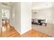 View of the dining room off the entry showcasing chandelier and views into the kitchen at 5745 Crystal Springs Way, Powder Springs, GA 30127