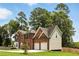 Beautiful two-story home with brick and vinyl siding, attached two-car garage, and a well-maintained lawn at 5745 Crystal Springs Way, Powder Springs, GA 30127