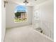 Bright hallway features a large arched window and white staircase, creating an open and airy feel at 5745 Crystal Springs Way, Powder Springs, GA 30127
