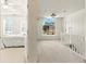 Hallway featuring a bedroom and staircase, natural light coming from the window at 5745 Crystal Springs Way, Powder Springs, GA 30127