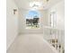 Bright hall with large arched window overlooking front yard at 5745 Crystal Springs Way, Powder Springs, GA 30127