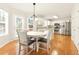 Eat-in kitchen features stainless steel appliances, recessed lighting, and bright bay windows at 5745 Crystal Springs Way, Powder Springs, GA 30127
