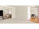 Spacious living room with neutral paint and carpet, adjacent to a dining room and living room at 5745 Crystal Springs Way, Powder Springs, GA 30127