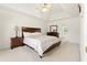 Comfortable main bedroom with tray ceiling, neutral carpet, and ensuite bathroom at 5745 Crystal Springs Way, Powder Springs, GA 30127