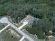 Expansive aerial view showcases the home's setting in a serene neighborhood with mature trees at 106 Belmont Dr, Canton, GA 30115