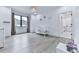 Spacious Bedroom featuring sleek flooring, a white crib, and ample natural light at 106 Belmont Dr, Canton, GA 30115