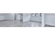 Bright bedroom featuring light gray wood floors, white walls, and multiple windows at 106 Belmont Dr, Canton, GA 30115
