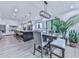 Bright kitchen features island with seating and dining table at 106 Belmont Dr, Canton, GA 30115
