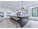 Kitchen features black island with seating and modern appliances at 106 Belmont Dr, Canton, GA 30115