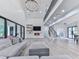 The living room has high ceilings, modern fireplace and staircase to the 2nd floor loft at 106 Belmont Dr, Canton, GA 30115