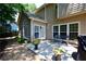 Backyard patio with comfortable seating and a grill for outdoor entertaining at 340 Channings Lake Dr, Lawrenceville, GA 30043