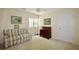 Comfortable bedroom featuring a sitting area, natural light, and neutral decor at 340 Channings Lake Dr, Lawrenceville, GA 30043