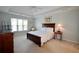 Cozy bedroom with tray ceiling, ceiling fan, and carpeted flooring at 340 Channings Lake Dr, Lawrenceville, GA 30043