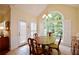 Bright breakfast nook features large windows and a charming dining set at 340 Channings Lake Dr, Lawrenceville, GA 30043