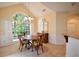 Bright breakfast nook with large arched window and view of landscaped yard at 340 Channings Lake Dr, Lawrenceville, GA 30043