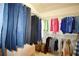 Walk-in closet showcasing ample storage for clothing and personal items at 340 Channings Lake Dr, Lawrenceville, GA 30043