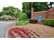 Community entrance sign with well-maintained landscaping and floral accents at 340 Channings Lake Dr, Lawrenceville, GA 30043
