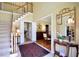 Inviting foyer showcases staircase and entry to dining room with beautiful decor at 340 Channings Lake Dr, Lawrenceville, GA 30043
