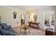 Cozy living room featuring hardwood floors and an open doorway at 340 Channings Lake Dr, Lawrenceville, GA 30043