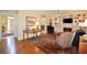 Open living room with hardwood floors, built-in shelving, and large windows at 340 Channings Lake Dr, Lawrenceville, GA 30043