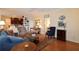Spacious living room with hardwood floors, open to kitchen, and comfortable furniture at 340 Channings Lake Dr, Lawrenceville, GA 30043