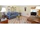 Comfortable living room includes a sofa, side tables, and decorative rug at 340 Channings Lake Dr, Lawrenceville, GA 30043