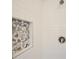 Close-up view of shower with white subway tile and river rock niche at 340 Channings Lake Dr, Lawrenceville, GA 30043