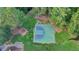 Aerial view of community outdoor basketball court surrounded by trees and grass at 350 River Walk Ter, Johns Creek, GA 30024