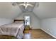 Bright bedroom with hardwood floors, ceiling fan, and window view at 350 River Walk Ter, Johns Creek, GA 30024