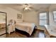 Serene bedroom with hardwood floors, a ceiling fan, and natural light at 350 River Walk Ter, Johns Creek, GA 30024