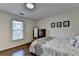 Comfortable bedroom with hardwood floors, ample natural light, and stylish decor at 350 River Walk Ter, Johns Creek, GA 30024