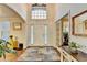 Inviting foyer with hardwood floors, high ceilings, and ample natural light at 350 River Walk Ter, Johns Creek, GA 30024