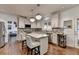 Bright kitchen with white cabinets, granite countertops, and stainless steel appliances at 350 River Walk Ter, Johns Creek, GA 30024