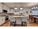 Updated kitchen with granite counters, stainless steel appliances, and breakfast bar seating at 350 River Walk Ter, Johns Creek, GA 30024