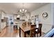Spacious kitchen and dining area with modern appliances and hardwood floors at 350 River Walk Ter, Johns Creek, GA 30024