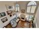 Bright living area with soaring ceilings, ample natural light, and a cozy fireplace at 350 River Walk Ter, Johns Creek, GA 30024