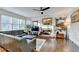 Inviting living room features a cozy brick fireplace and hardwood floors, perfect for relaxing at 350 River Walk Ter, Johns Creek, GA 30024