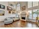 Bright living room with hardwood floors, fireplace, and lots of natural light at 350 River Walk Ter, Johns Creek, GA 30024